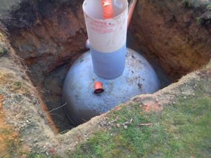 septic tank installation with concrete backfill