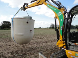 Sewage treatment plant transported to back garden for installation