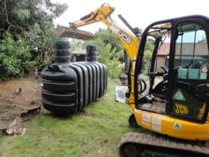 Septic transported from drive to back garden ready for installation